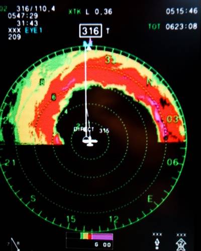 Image of radar screen showing the eyewall in front of the plane.