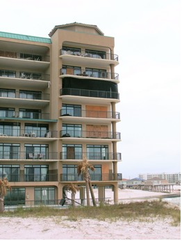 Image showing a black hurricane screen on a sixth-story balcony of a building in Pensacola, FL.