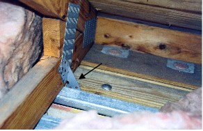 Example of roof tie-down clip in a homeowner's attic.