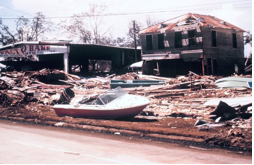 A house with debris scattered everywhere